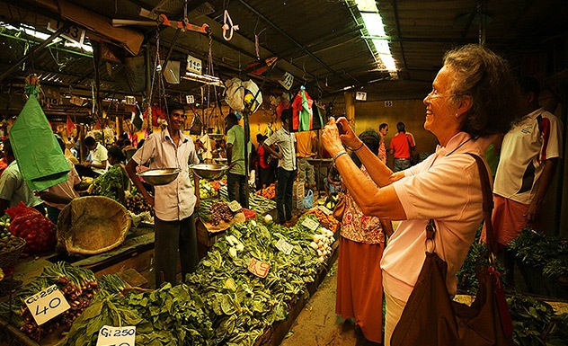 Stroll and shop at Kandy's Central Market .